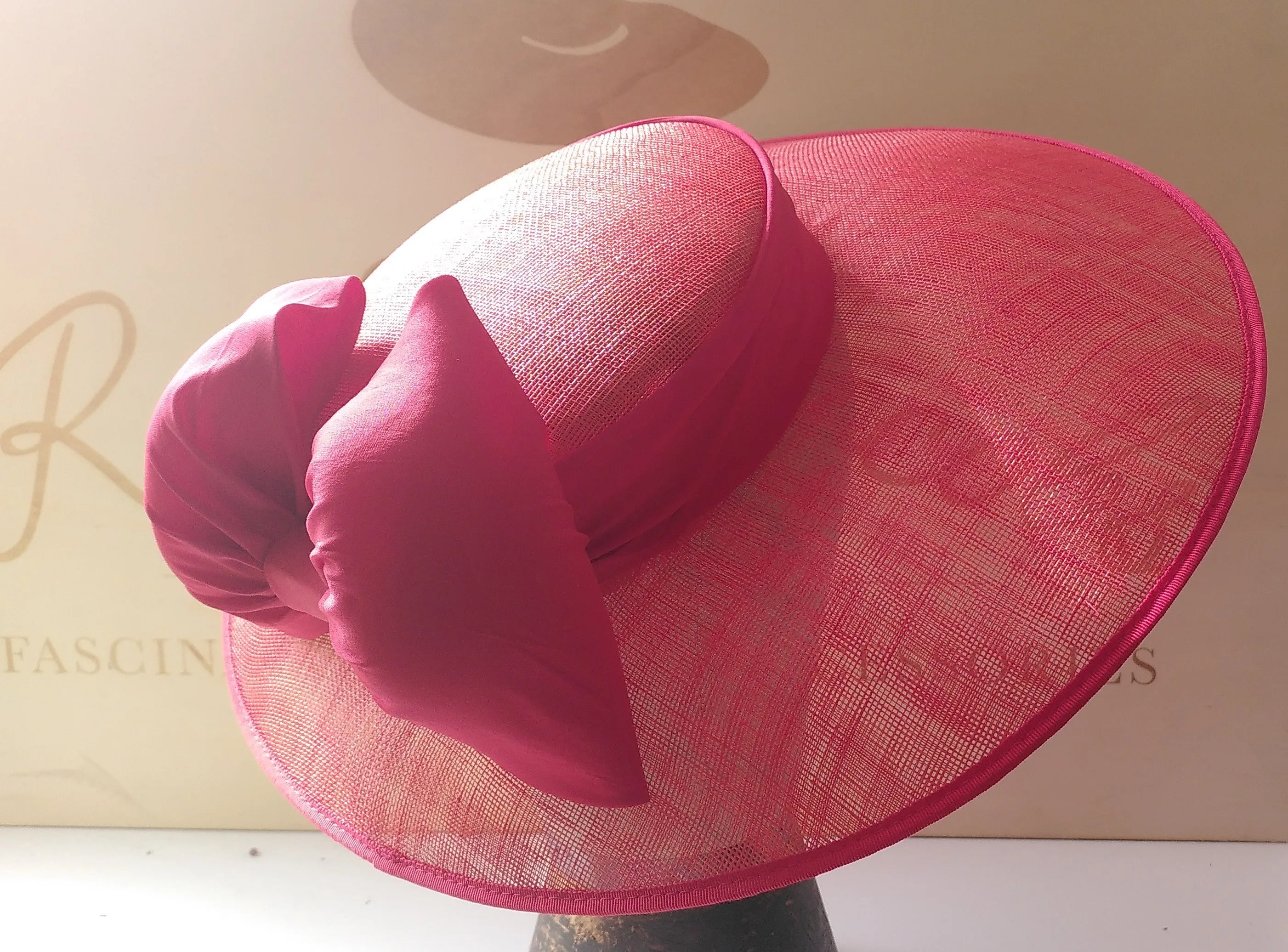 Red wedding hat with silk red bow.