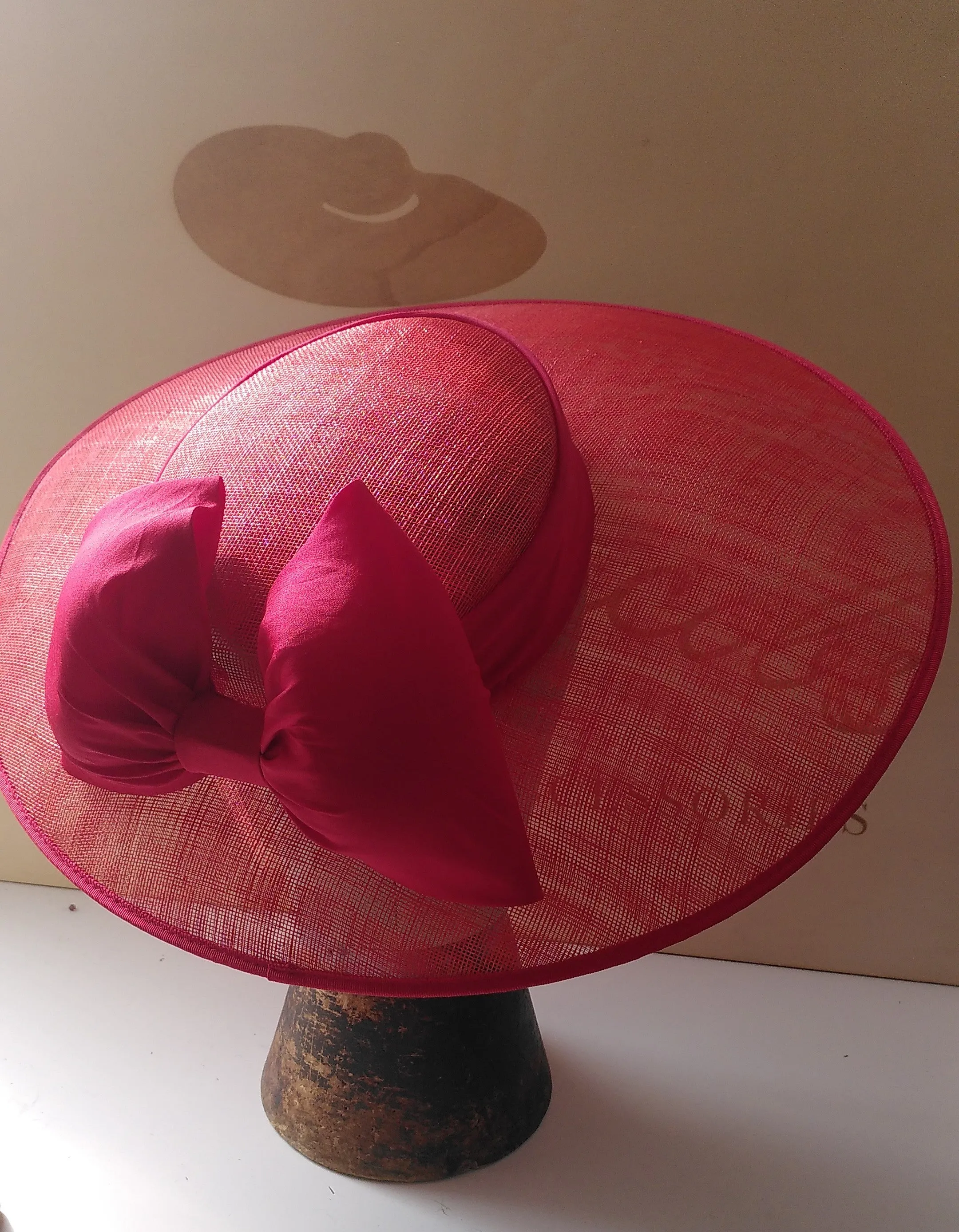 Red wedding hat with silk red bow.